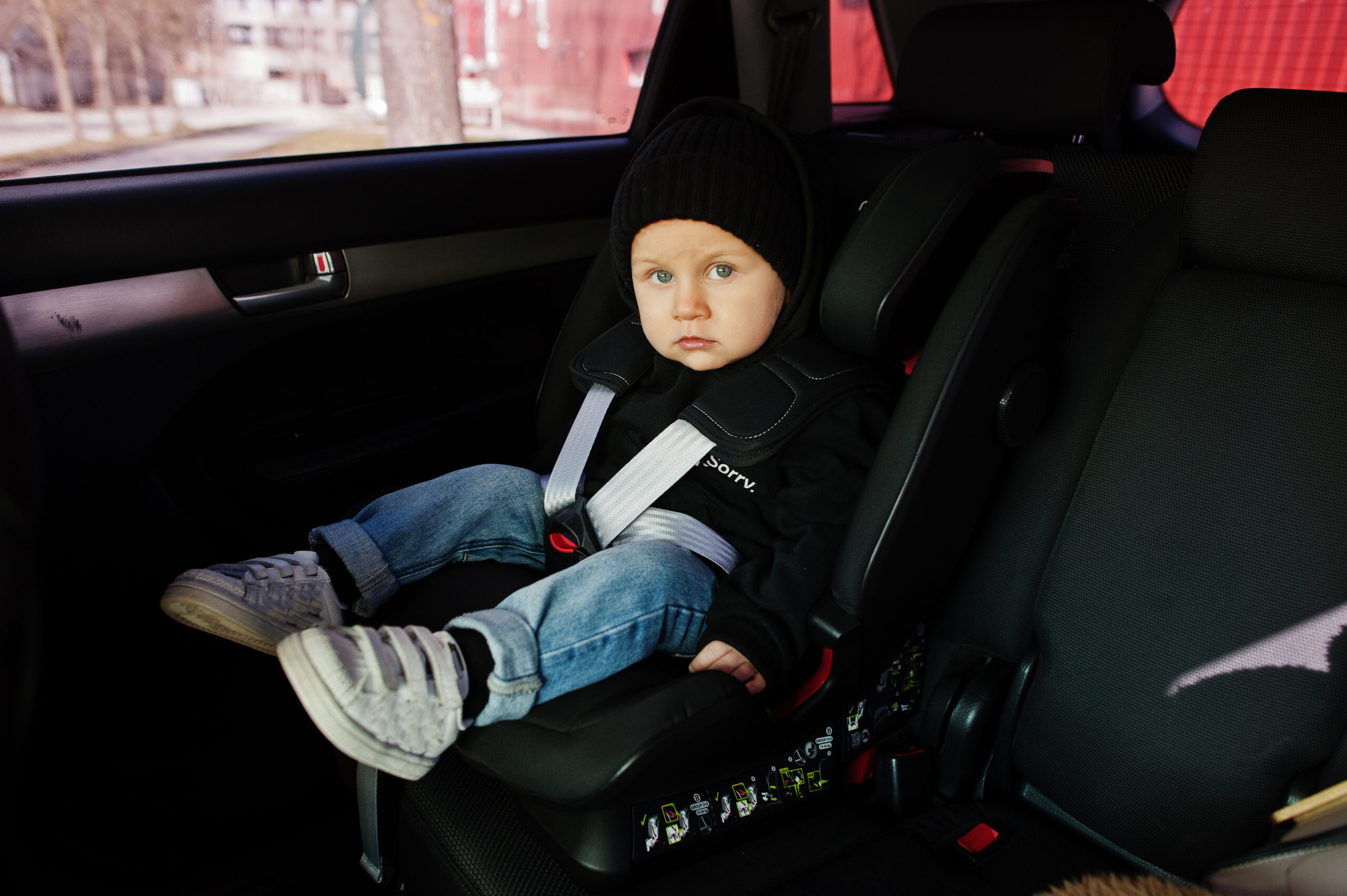 Baby sitting on car seat